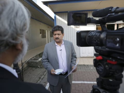 Pakistani journalist Hamid Mir speaks during an interview with The Associated Press, in Islamabad.  