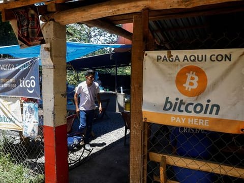Bitcoin banners are seen outside of a small restaurant at El Zonte Beach in Chiltiupan, El Salvador.