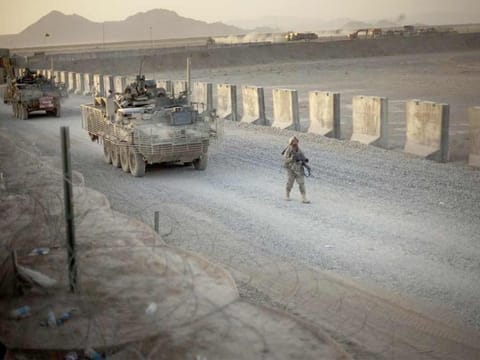 File photo: US soldiers from the 5th Striker Brigades walk next to armored vehicles as they arrive at their base on the outskirts of Spin Boldak, about 100 kilometers southeast of Kandahar, Afghanistan. 
