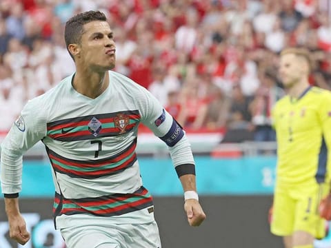 Portugal's forward Cristiano Ronaldo celebrates after scoring his team's third goal during the UEFA EURO 2020 Group F football match against Hungary at the Puskas Arena in Budapest on June 15, 2021. 