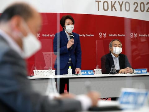 Tokyo 2020 Olympics Organizing Committee President Seiko Hashimoto (centre), flanked by Kawasaki City Institute for Public Health Director General Nobuhiko Okabe (right) speaks at a round table meeting with medical experts to discuss on COVID-19 counter measures, in Tokyo in June.