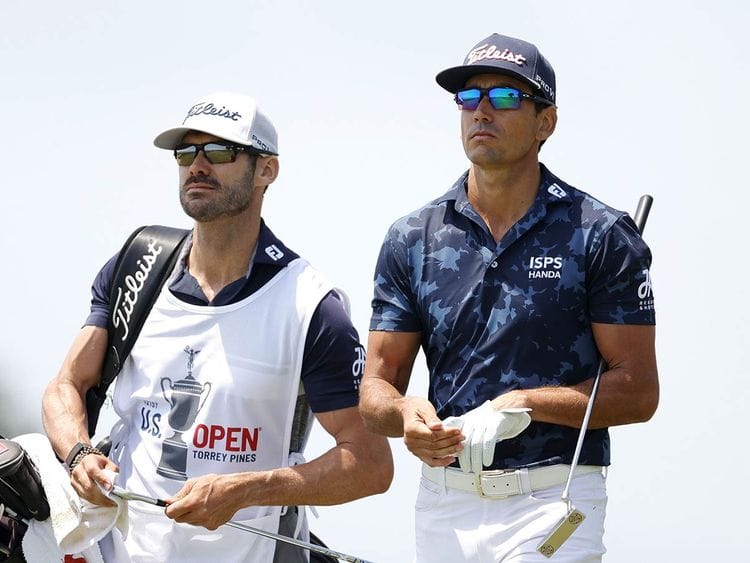 Rafa Cabrera Bello walks with his caddie and brother Miguel Cabrera Bello  