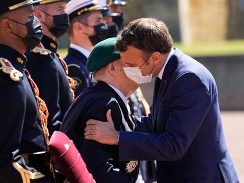 WWII French veterans Leon Gautier, 98 years old last survivor of the Kieffer Commando, left, is honored by French President Emmanuel Macron with the Legion of Honor during a WWII ceremony to mark the 81st anniversary of late French Gen. Charles de Gaulle's resistance call from London on June 18, 1940, at the Mont Valerien, in Suresnes, near Paris on June 18.
