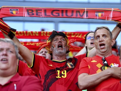 Belgium fans cheer during the Euro 2020 championship Group B match against Denmark at the Parken stadium in Copenhagen.