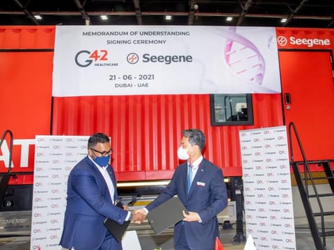  Ashish Koshy, CEO of G42 Healthcare and James Park, Seegene Executive Director sign the agreement.