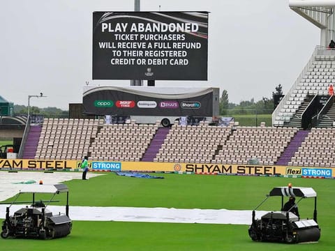 An announcement is displayed on a large screen that the play for the day has been abandoned on the fourth day of the World Test Championship final cricket match between New Zealand and India, at the Rose Bowl in Southampton, England, on June 21, 2021. 