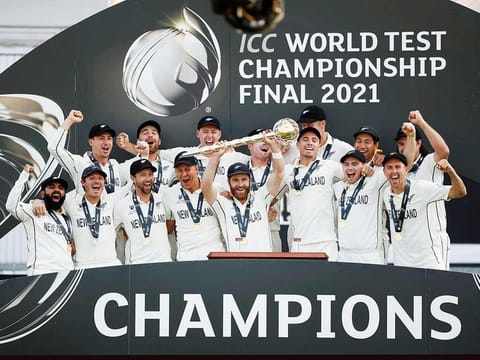 New Zealand's Kane Williamson and teammates celebrate with the trophy after winning the World Test Championship final against India, at Rose Bowl, Southampton.  