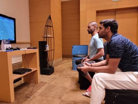 Shikhar Dhawan (far) and Bhuvaneshwar Kumar, captain and vice-captain of the Indian team for Sri Lanka tour, locked in a Playstation duel in the team hotel in Chennai.