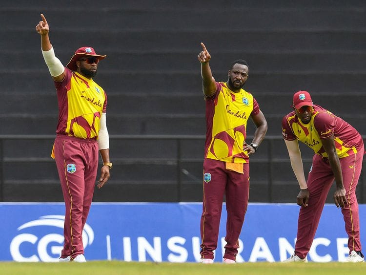 Kieron Pollard, Andre Russell and Jason Holder of West Indies set the field against South Africa 