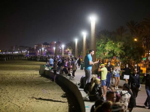People party in Playa de Palma beach on the island of Mallorca, as Spanish regions with a low COVID-19 infection rate were allowed to reopen nightlife with some restrictions, in Mallorca, on June 5, 2021. 
