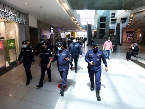 Security officers tour The Avenues Mall in Kuwait City, the country's largest shopping centre.  According to the rules set by the Civil Service Commission, Kuwait's state employment agency, for implementing the system, each government agency is authorised to set the evening working hours, with a total of four and a half hours worked per day. 