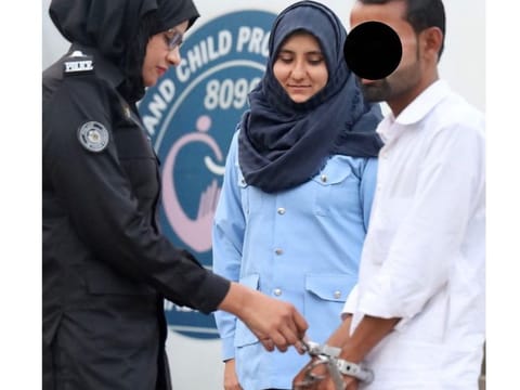  The harasser being arrested by woman police officer in Islamabad.