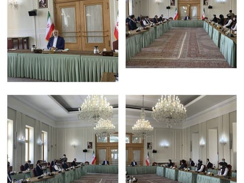 This combinations of photos released by the Iranian Foreign Ministry, shows a meeting between two delegations from Taliban and government of Afghanistan hosting by Iranian Foreign Minister Mohammad Javad Zarif, in Tehran, on July 7, 2021.  