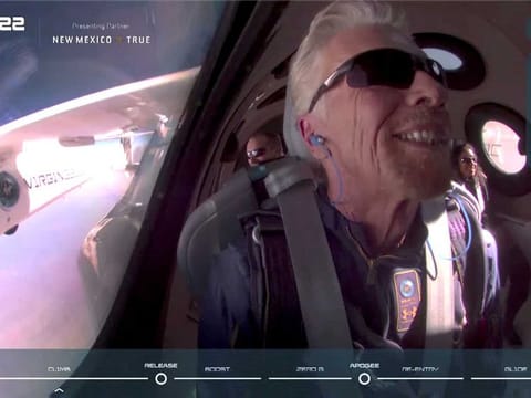  Billionaire Richard Branson smiles on board Virgin Galactic's passenger rocket plane VSS Unity before starting its untethered ascent to the edge of space above Spaceport America near Truth or Consequences, New Mexico, U.S. July 11, 2021 in a still image from video.   