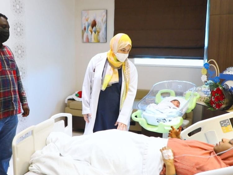 Dr. Mona is interacting with the patient and checking on her health conditions-1626068068747