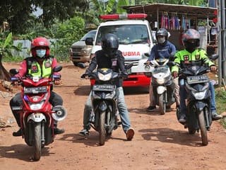 Photos: Bikers clear Indonesian streets for ambulances