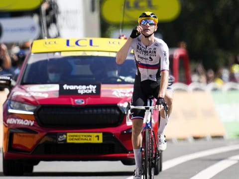 Slovenia's Matej Mohoric gestures to "zip it" or be quiet as he crosses the finish line to win the nineteenth stage of the Tour de France cycling race over 207 kilometers (128.6 miles) with start in Mourenx and finish in Libourne, France, Friday, July 16, 2021. Mohoric's team was subject of a police raid on Wednesday night July 14, 2021.