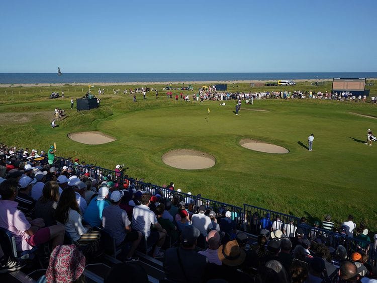 Open leader Louis Oosthuizen putts on the 12th green as Royal St George's bakes in the sun