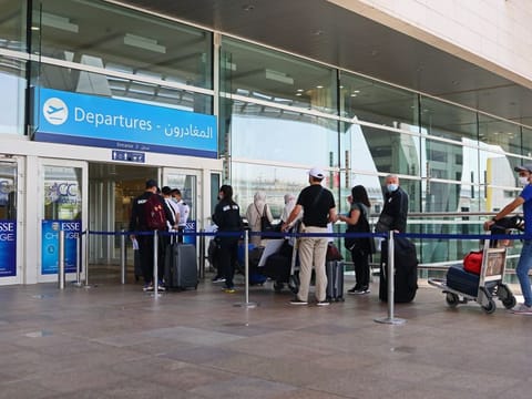 Travellers enter Dubai International Airport to depart for the Eid holidays.