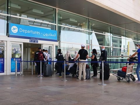 Travellers enter Dubai International Airport to depart for the Eid holidays.