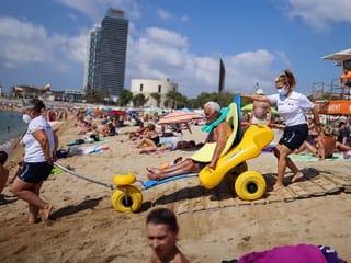 Photos: Barcelona helps disabled beachgoers frolic in waves