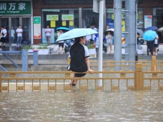 Photos: Flooding in central China turns streets to rivers