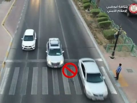 A screen grab of Abu Dhabi Police video posted on its twitter account warning motorists that they must stop at the pedestrian crossings to allow people cross the road. 