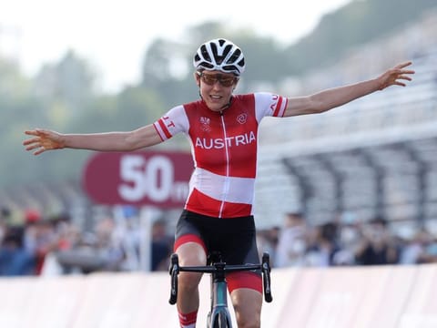 Austria's Anna Kiesenhofer launched a remarkable solo breakaway to win road race gold on her Olympic debut.