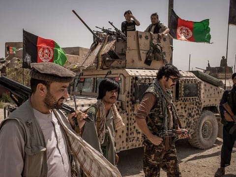 Militia and Afghan National Army soldiers near the front line with the Taliban, in the Balkh province of Afghanistan, July 10, 2021.  