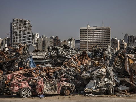 Damaged automobiles and scrap in the Port of Beirut July 19, 2021. The massive August 4 blast at the port killed about 200 people, injured thousands more, and damaged or destroyed 300,000 homes.  
