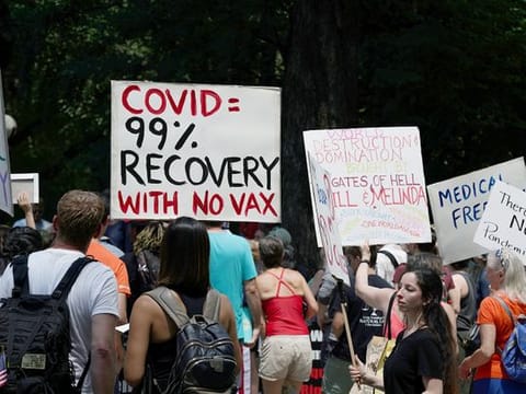 People gather during an anti-vaccine demonstration, in Central Park, New York City 