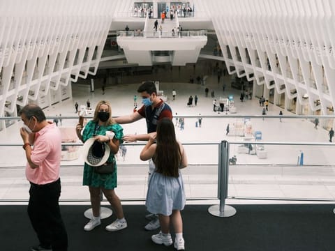 People walk through the Oculus Mall in Manhattan on July 29, 2021 in New York City. Numerous stores in the mall, including the Apple store, have required guests to start wearing masks again as the Delta variant of COVID-19 spreads through New York City. 