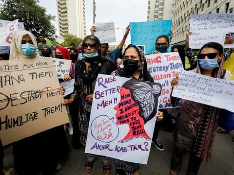 People protesting against the killing of Noor Mukadam, 27 and condemning violence against women and girls in Karachi on July 25, 2021. 