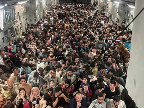 This image distributed Courtesy of the US Air Force shows the inside of Reach 871, a U.S. Air Force C-17 Globemaster III flown from Kabul to Qatar on August 15, 2021. The plane safely evacuated some 823 Afghans from Kabul late Sunday, according to US defence officials contacted by Defense One. 