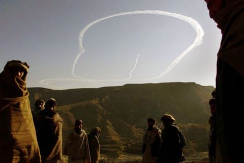 Contrails show an American B-52’s route back to Tora Bora to strike at Al Qaida hideouts on December 12, 2001, after Afghan elders’ ceaseifire talks with Taliban forces collapsed. Just as the United States was set to withdraw its military from Afghanistan after nearly 20 years of war, the Taliban took over Kabul, the country’s capital. 