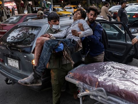 A person wounded in a bomb blast outside the airport in Kabul, Afghanistan on Thursday, Aug. 26, 2021, arrives at a hospital in Kabul. 
