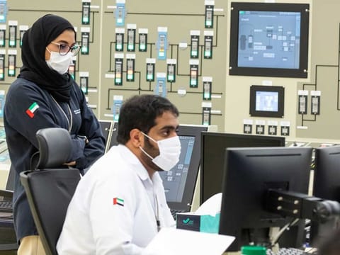 Female Emirati nuclear reactor operator Hind with her colleague Abdullah at the Unit 2 of the Barakah Nuclear Energy Plant.