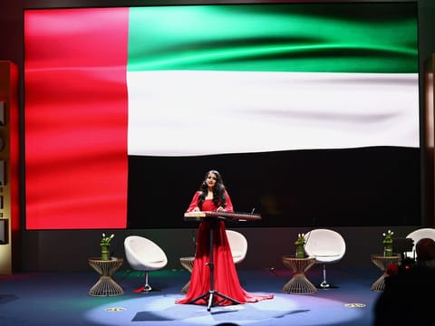A performer renders the UAE National Anthem at the opening of the seventh Emirati Women’s Forum on Thursday.
