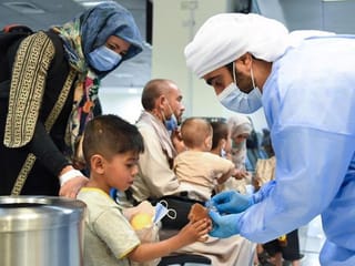 First photos: Afghan families land early Friday in the UAE