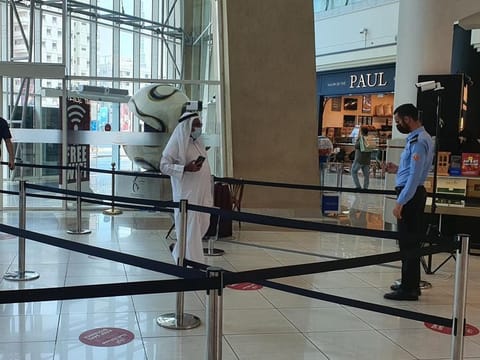 Visitors entering Al Wahda Mall in Abu Dhabi have to show the status on their Al Hosn app to mall security in order to be allowed inside..  
