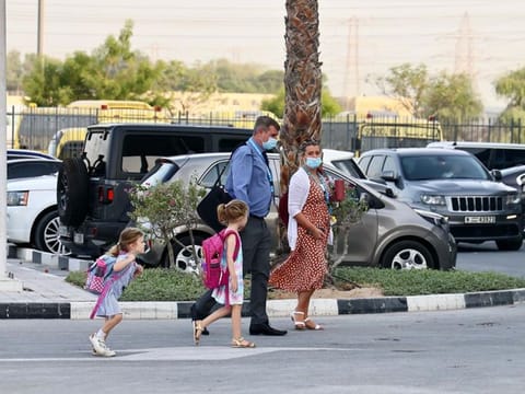 Parents dropping off students at the GEMS Wellington Academy at Al Khail in Dubai this morning 