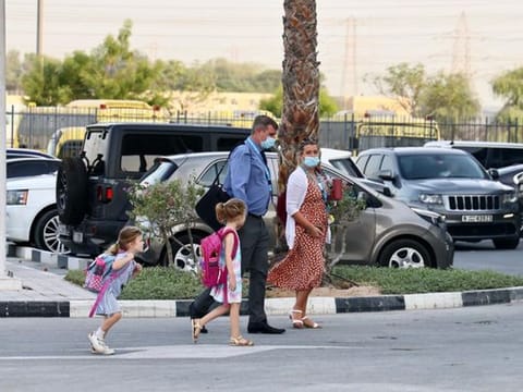 Parents dropping off students at the GEMS Wellington Academy at Al Khail in Dubai this morning 