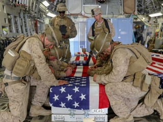 Photos: Biden attends grim homecoming for U.S. troops killed in Afghanistan attack