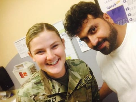 Amrullah Mohammad Yousef with an American soldier. He is in a camp in Texas hoping to reach the UK to start his masters. 