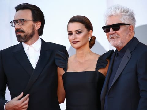 Director Pedro Almodovar, from right, Penelope Cruz and Israel Elejalde pose for photographers upon arrival at the premiere of the film 'Parallel Mothers' and the opening ceremony of the 78th edition of the Venice Film Festival in Venice, Italy, Wednesday, Sep, 1, 2021.