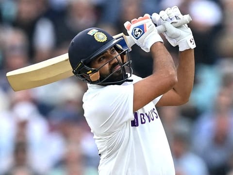 Take that! Rohit Sharma reaches his century with a six on the third day of the fourth Test against England at the Oval.