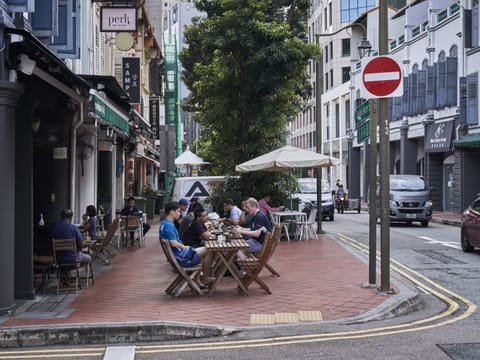 Customers at a cafe in the central business district in Singapore, on Monday, September 6, 2021.  