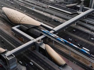 Which Dubai Metro Station has free parking for commuters?
