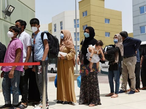 Evacuees from Afghanistan arrive at Emirates Humanitarian City in Abu Dhabi, on August 28, 2021. 