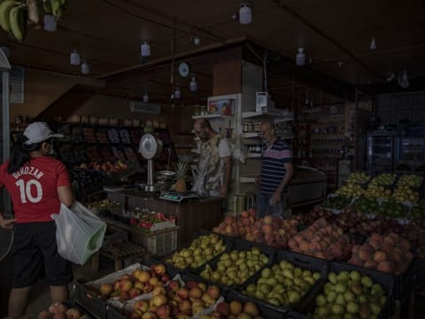 A customer shops in a grocery store during a power cut in Beirut on September 7, 2021. Egypt agreed to supply natural-gas to Lebanon through Jordan and Syria as the Arab states seek to help end power shortages in their crisis-ridden neighbour. 